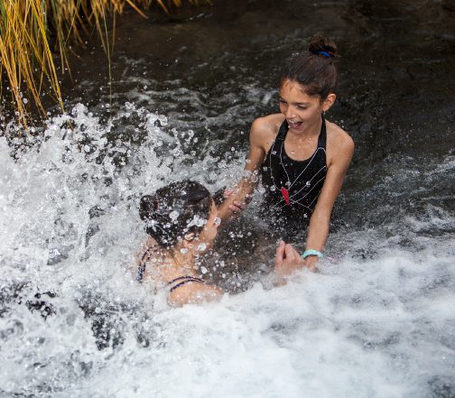 Family enjoying the Puritama Hotsprings in Atacama.