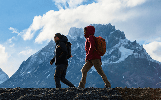 Two people hiking in torres del Piane