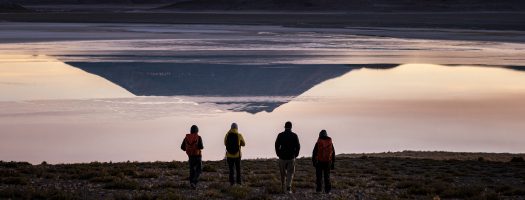 People looking an Altiplano Lagoon.