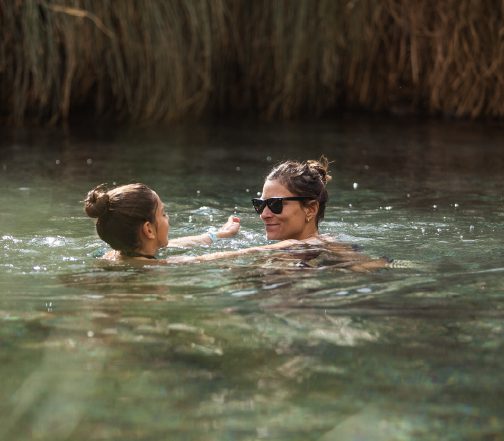 Family enjoying thermal waters at Atacama.