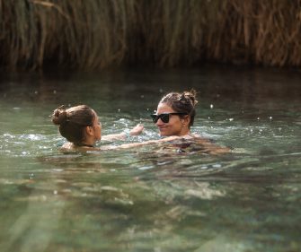 Family enjoying thermal waters at Atacama.