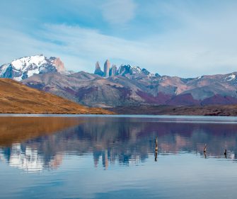 Laguna Azul reflecting Torres del Paine granite towers and snow-capped peaks in Torres del Paine National Park, Chile