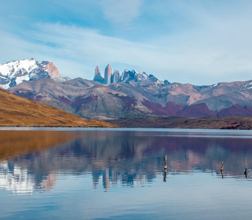 Laguna Azul reflecting Torres del Paine granite towers and snow-capped peaks in Torres del Paine National Park, Chile